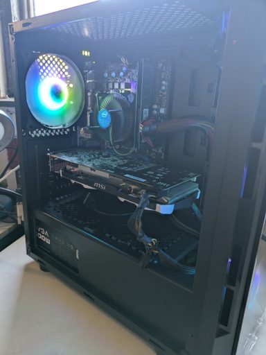 Intel Core i5-2400/16GB DDR3/256GB SSD/GTX960 4GB A black computer tower with RGB lighting and visible internal components.