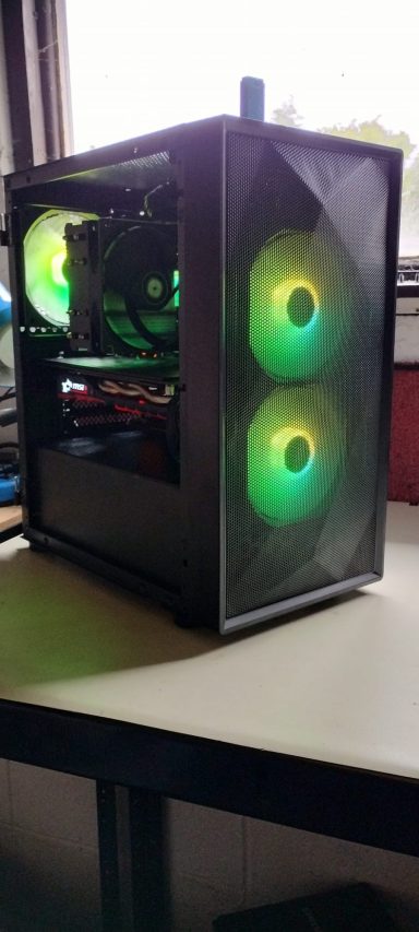 Intel Core i5-7400/16GB DDR4/512GB SSD/GTX1060 6GB Black computer tower with green LED fans, displaying components through a transparent side panel.