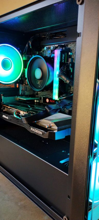 Ryzen 5 5500/16GB DDR4/1TB SSD/RX6600 8GB Black computer case with RGB lighting and visible internal components.