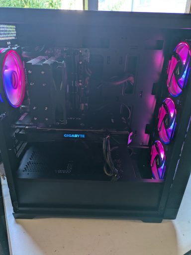 Intel Core i7-4790/16GB DDR3/512GB SSD/GTX1070 Ti 8GB A gaming PC with RGB lighting and a glass side panel showcasing internal components.