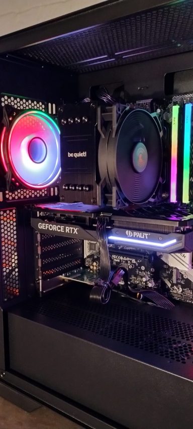 Ryzen 7 5700X/32GB DDR4/1TB SSD/RTX4060 Ti 8GB A desktop computer setup with RGB lighting and a sleek design.